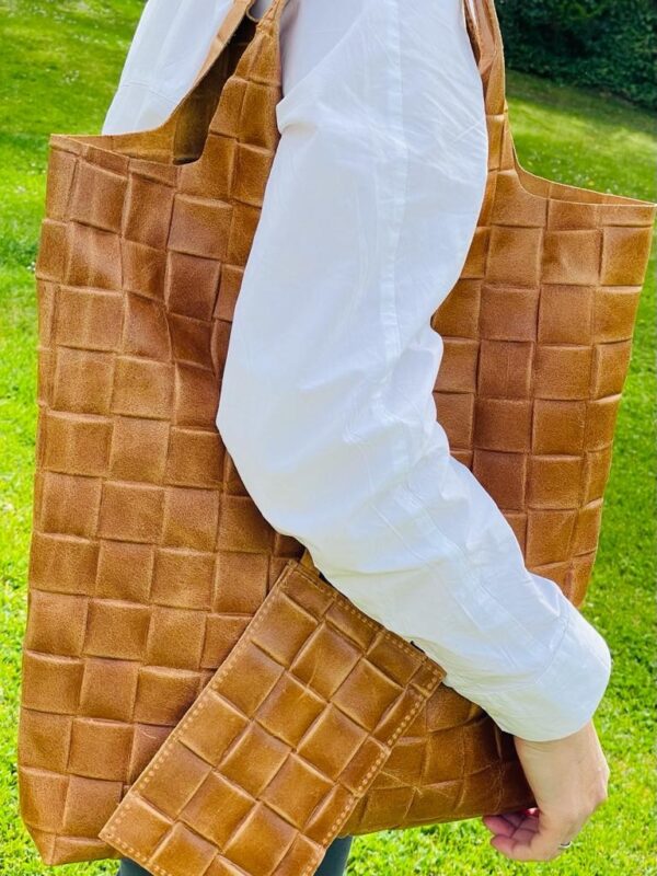 Bolso saco piel con efecto trenzado