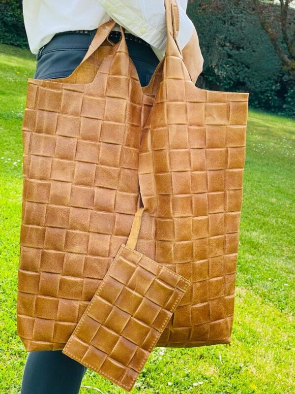 Bolso saco piel con efecto trenzado