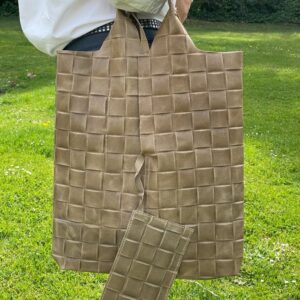 Bolso saco piel con efecto trenzado