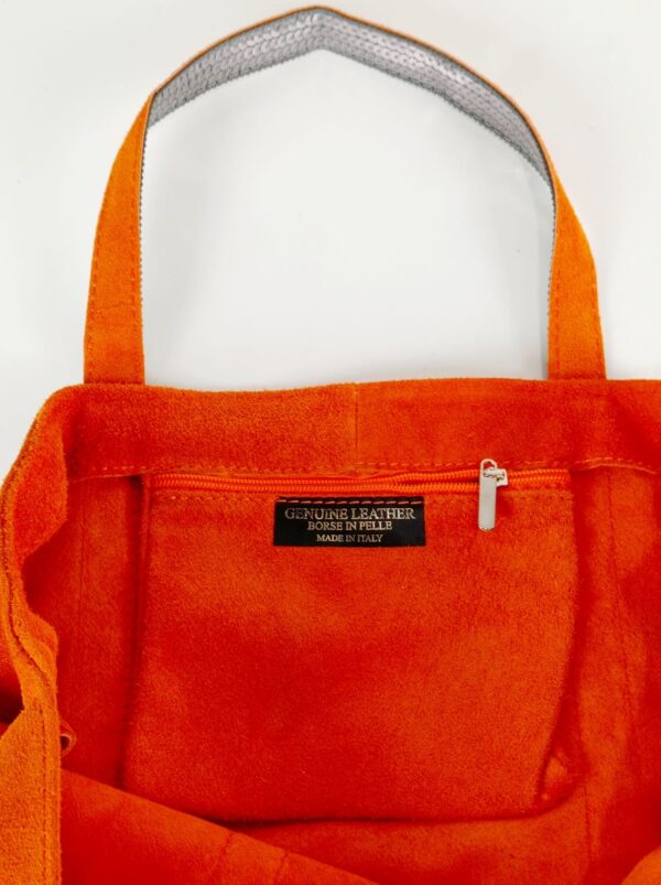 Bolso de piel con serraje y brillo estampado