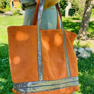 Bolso de piel con serraje y brillo estampado