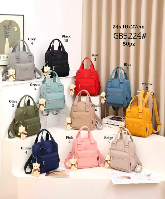 Mochila de Mujer en Tela Nylon con 2 Asas Cortas, Bolsillo Frontal y Osito Decorativo-All- Mayorista España